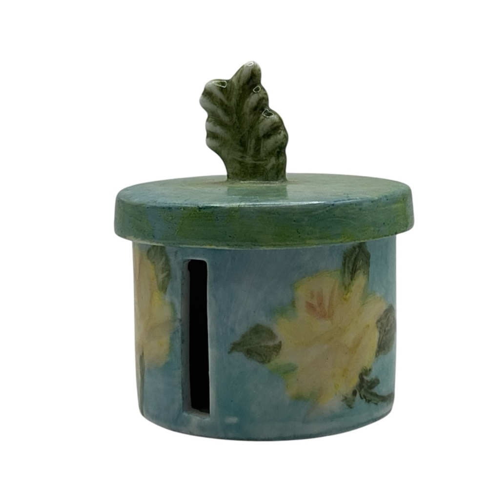 Vintage stamp roll holder made of porcelain. 
Or Trinket Box with Leaf Knob